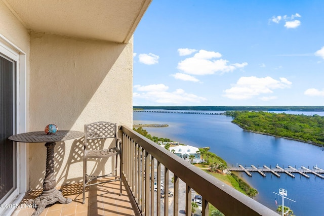 balcony featuring a water view