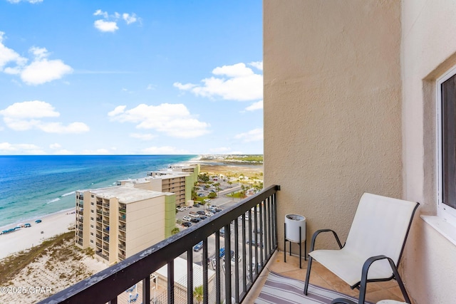 balcony featuring view of water and beach