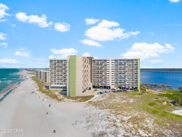 aerial view of expansive beach and apartment complex