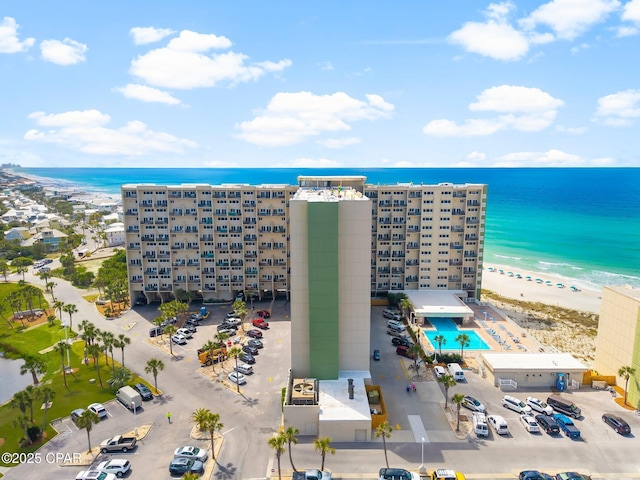 aerial view of apartment complex and a large body of water