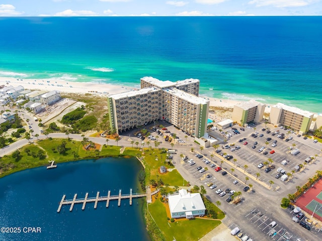 bird's eye view of expansive beach and apartment complex
