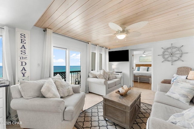 living room featuring tile patterned floors, a ceiling fan, and wood ceiling