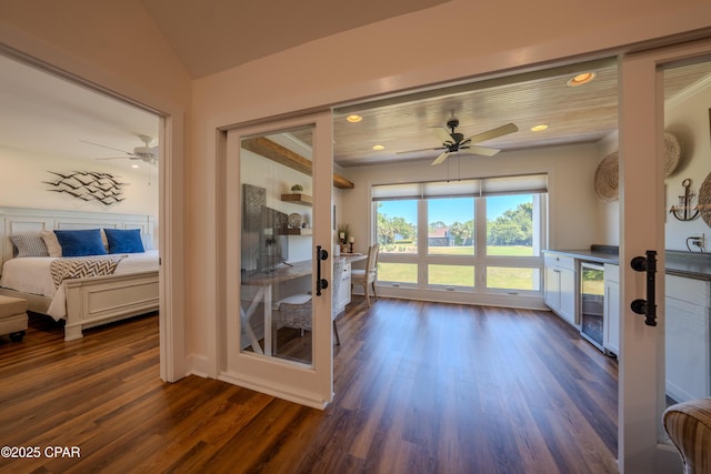 sunroom featuring beverage cooler and french doors