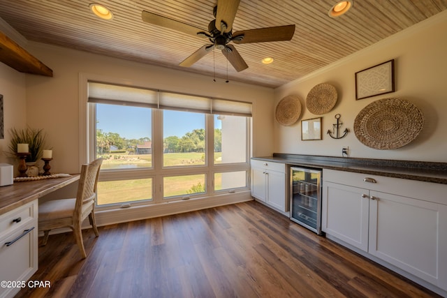 indoor dry bar with beverage cooler, crown molding, a ceiling fan, wooden ceiling, and recessed lighting