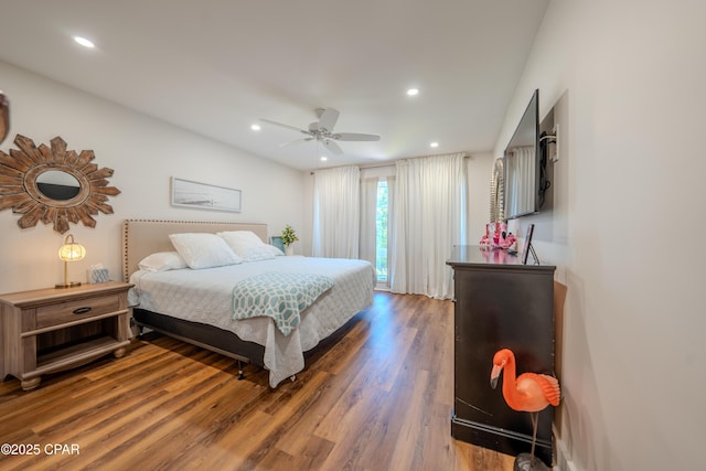bedroom with wood finished floors, recessed lighting, and a ceiling fan