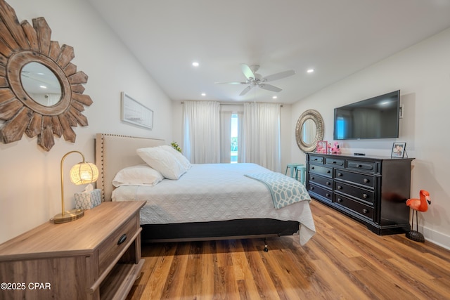 bedroom with wood finished floors, recessed lighting, baseboards, and ceiling fan