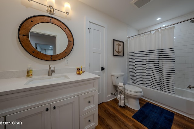 full bath with toilet, vanity, wood finished floors, shower / bath combo with shower curtain, and recessed lighting