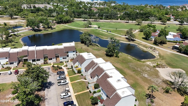 drone / aerial view of a large body of water and a golf course
