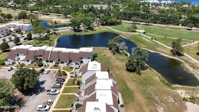 aerial view of property's location with a nearby body of water and a golf club