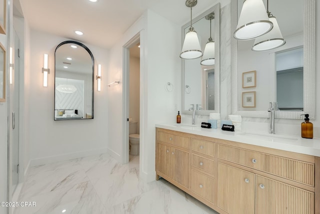 208 George C Wallace, Panama City Beach, FL 32413 - full bath featuring recessed lighting, toilet, double vanity, baseboards, and marble finish floors