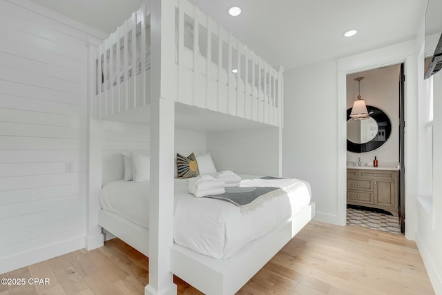 208 George C Wallace, Panama City Beach, FL 32413 - bedroom featuring light wood finished floors, recessed lighting, and ensuite bathroom