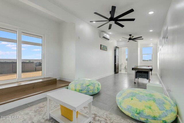 208 George C Wallace, Panama City Beach, FL 32413 - tiled living area with ceiling fan, an AC wall unit, recessed lighting, and baseboards