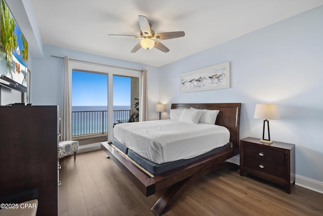 9860 S Thomas Dr Unit 1824, Panama City Beach, FL 32408 - bedroom featuring wood finished floors, a water view, access to outside, and a ceiling fan