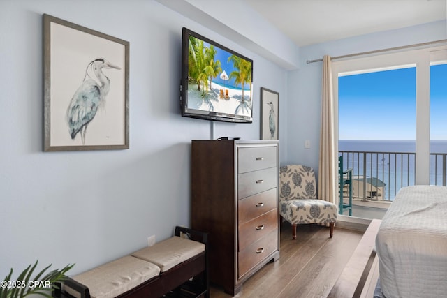 9860 S Thomas Dr Unit 1824, Panama City Beach, FL 32408 - bedroom with wood finished floors and access to exterior