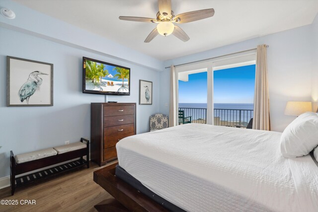 9860 S Thomas Dr Unit 1824, Panama City Beach, FL 32408 - bedroom featuring wood finished floors, access to exterior, and a ceiling fan