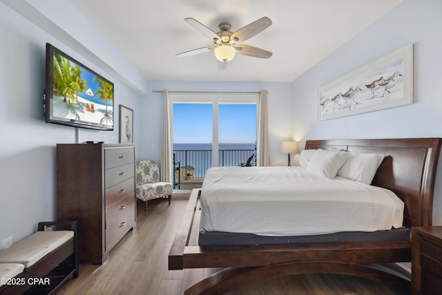 9860 S Thomas Dr Unit 1824, Panama City Beach, FL 32408 - bedroom featuring wood finished floors, access to outside, and a ceiling fan