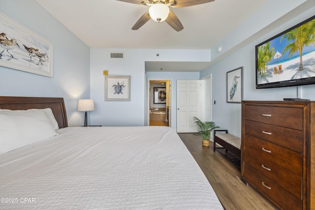 9860 S Thomas Dr Unit 1824, Panama City Beach, FL 32408 - bedroom featuring dark wood-type flooring, connected bathroom, and ceiling fan