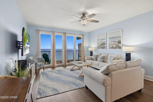 9860 S Thomas Dr Unit 1824, Panama City Beach, FL 32408 - living area with a ceiling fan and wood finished floors