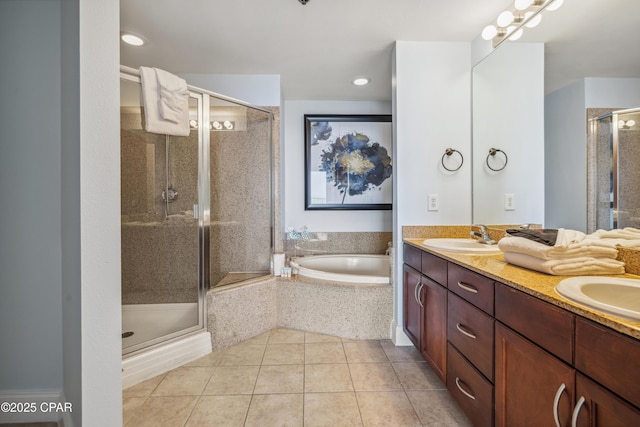 9860 S Thomas Dr Unit 1824, Panama City Beach, FL 32408 - full bathroom featuring a garden tub, double vanity, a stall shower, and tile patterned floors