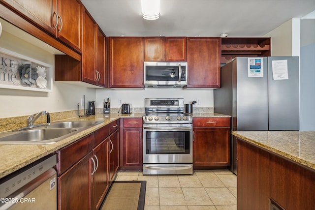 9860 S Thomas Dr Unit 1824, Panama City Beach, FL 32408 - kitchen with stainless steel appliances, dark brown cabinets, and light tile patterned flooring