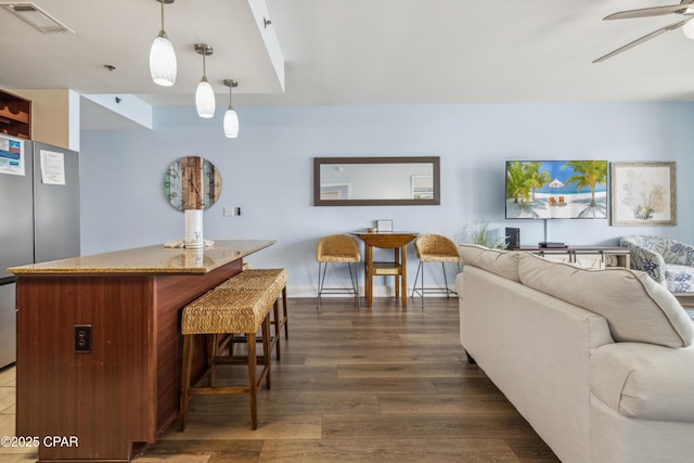 9860 S Thomas Dr Unit 1824, Panama City Beach, FL 32408 - living room with dark wood finished floors and a ceiling fan