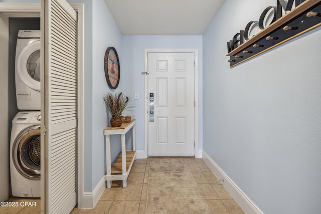 9860 S Thomas Dr Unit 1824, Panama City Beach, FL 32408 - laundry room with stacked washer / dryer and light tile patterned floors