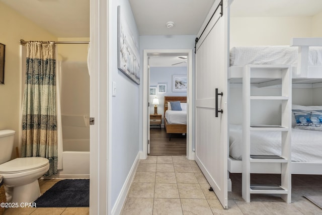 9860 S Thomas Dr Unit 1824, Panama City Beach, FL 32408 - ensuite bathroom featuring shower / tub combo and tile patterned flooring