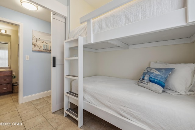 9860 S Thomas Dr Unit 1824, Panama City Beach, FL 32408 - bedroom featuring light tile patterned floors and baseboards
