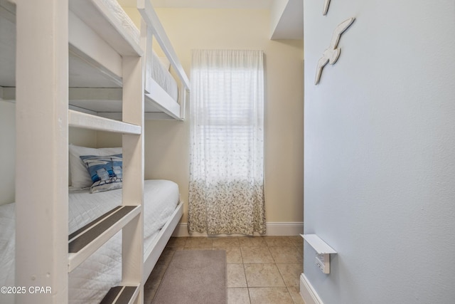 9860 S Thomas Dr Unit 1824, Panama City Beach, FL 32408 - tiled bedroom featuring baseboards