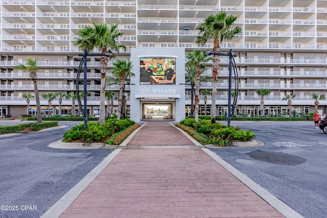 9860 S Thomas Dr Unit 1824, Panama City Beach, FL 32408 - view of apartment building / complex featuring uncovered parking