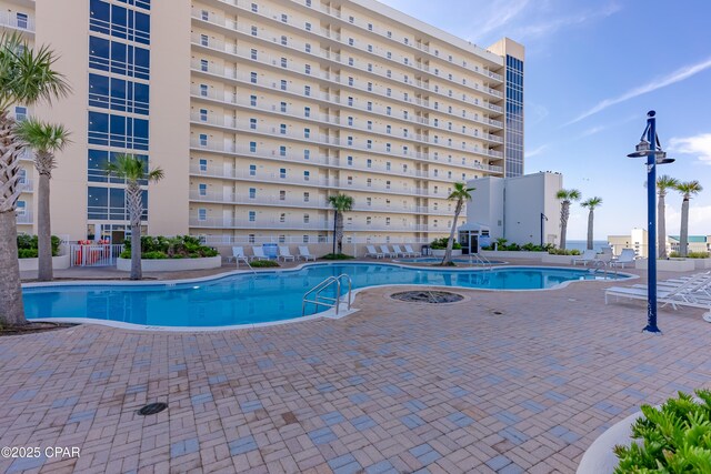 9860 S Thomas Dr Unit 1824, Panama City Beach, FL 32408 - community pool featuring a patio area