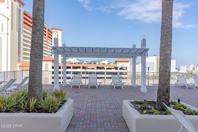 9860 S Thomas Dr Unit 1824, Panama City Beach, FL 32408 - view of property's community featuring a pergola and a patio area