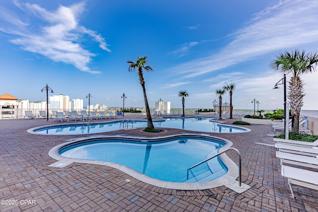 9860 S Thomas Dr Unit 1824, Panama City Beach, FL 32408 - community pool with a patio area