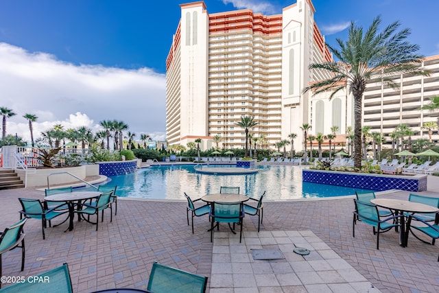 9860 S Thomas Dr Unit 1824, Panama City Beach, FL 32408 - community pool featuring outdoor dining space and a patio