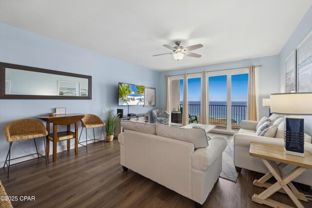 9860 S Thomas Dr Unit 1824, Panama City Beach, FL 32408 - living area with plenty of natural light, ceiling fan, and dark wood-style flooring