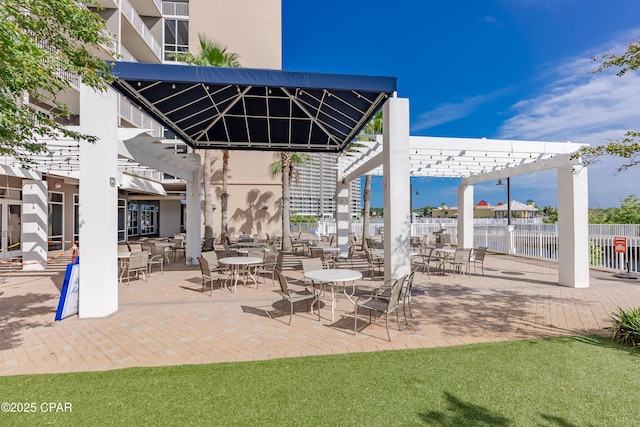 9860 S Thomas Dr Unit 1824, Panama City Beach, FL 32408 - view of patio / terrace with a pergola and a water view