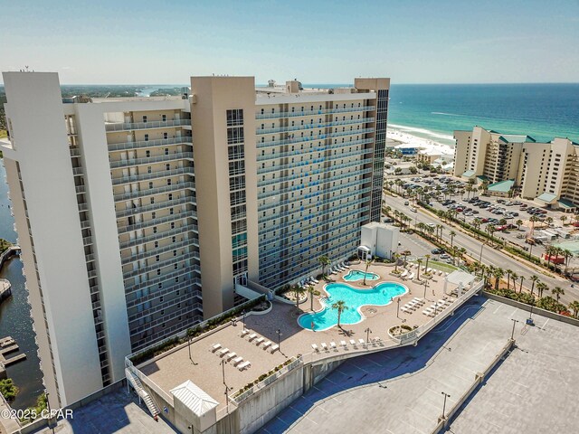 9860 S Thomas Dr Unit 1824, Panama City Beach, FL 32408 - view of apartment building / complex featuring a water view and a community pool