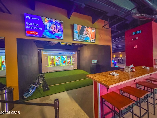 9860 S Thomas Dr Unit 1824, Panama City Beach, FL 32408 - game room featuring golf simulator and concrete floors