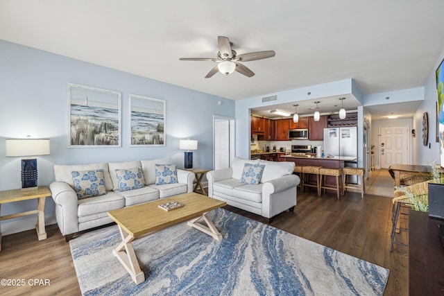 9860 S Thomas Dr Unit 1824, Panama City Beach, FL 32408 - living room featuring dark wood-type flooring and ceiling fan