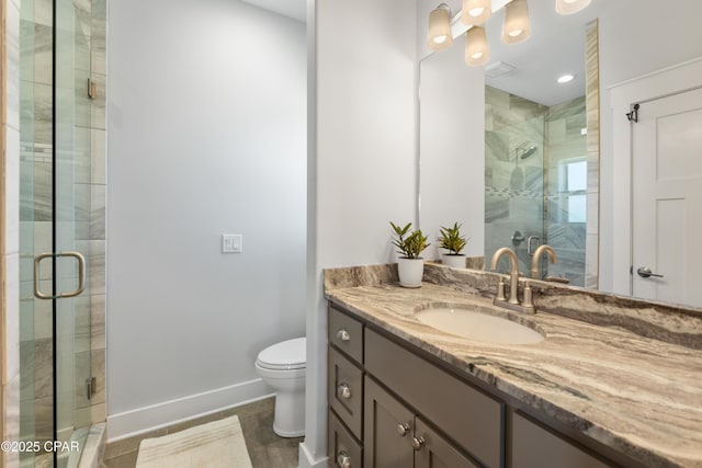 111 George C Wallace Blvd, Panama City Beach, FL 32413 - full bathroom with a stall shower, baseboards, toilet, and vanity