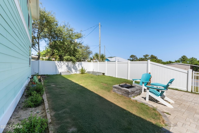 111 George C Wallace Blvd, Panama City Beach, FL 32413 - view of yard featuring a patio area and an outdoor fire pit