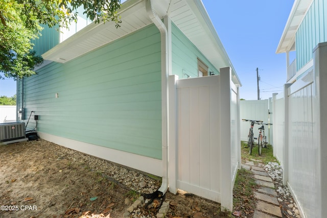 111 George C Wallace Blvd, Panama City Beach, FL 32413 - view of home's exterior featuring central air condition unit and fence