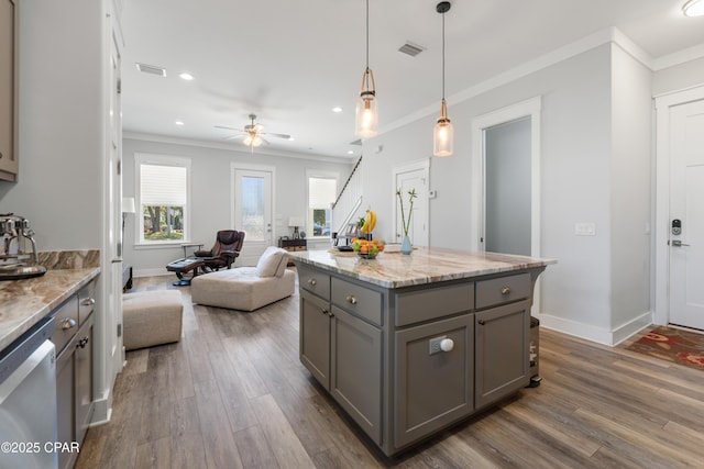 111 George C Wallace Blvd, Panama City Beach, FL 32413 - kitchen featuring gray cabinetry, ornamental molding, wood finished floors, open floor plan, and dishwasher