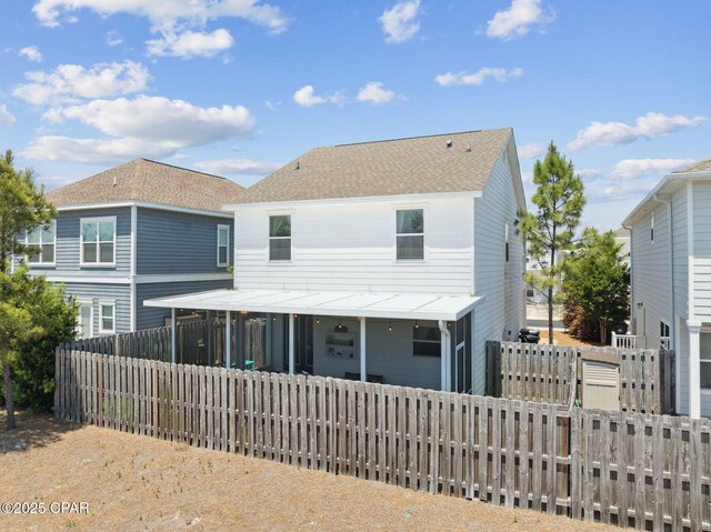 13 St. Vincent Lane, Inlet Beach, FL 32461 - rear view of property featuring a fenced backyard and roof with shingles