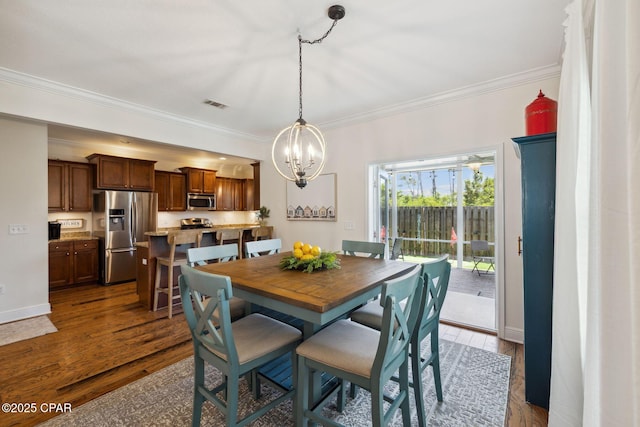 13 St. Vincent Lane, Inlet Beach, FL 32461 - dining area with a chandelier, crown molding, and dark wood finished floors
