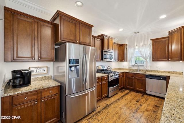 13 St. Vincent Lane, Inlet Beach, FL 32461 - kitchen featuring appliances with stainless steel finishes, recessed lighting, dark wood finished floors, crown molding, and light stone countertops