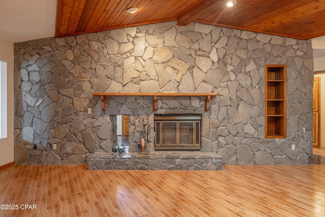 2324 Raintree Pl, Lynn Haven, FL 32444 - unfurnished living room with wooden ceiling, wood finished floors, a stone fireplace, and baseboards