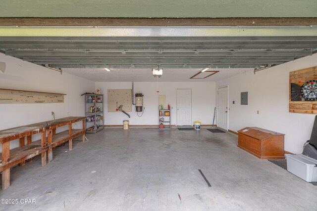 2324 Raintree Pl, Lynn Haven, FL 32444 - garage with electric panel, a central vacuum unit, a workshop area, and a garage door opener