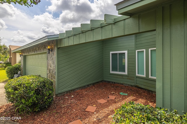 2324 Raintree Pl, Lynn Haven, FL 32444 - view of home's exterior with an attached garage and board and batten siding