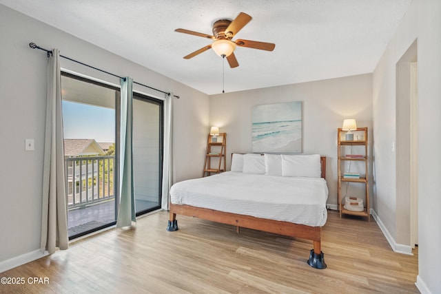 bedroom featuring light wood-style floors, access to outside, baseboards, and a ceiling fan